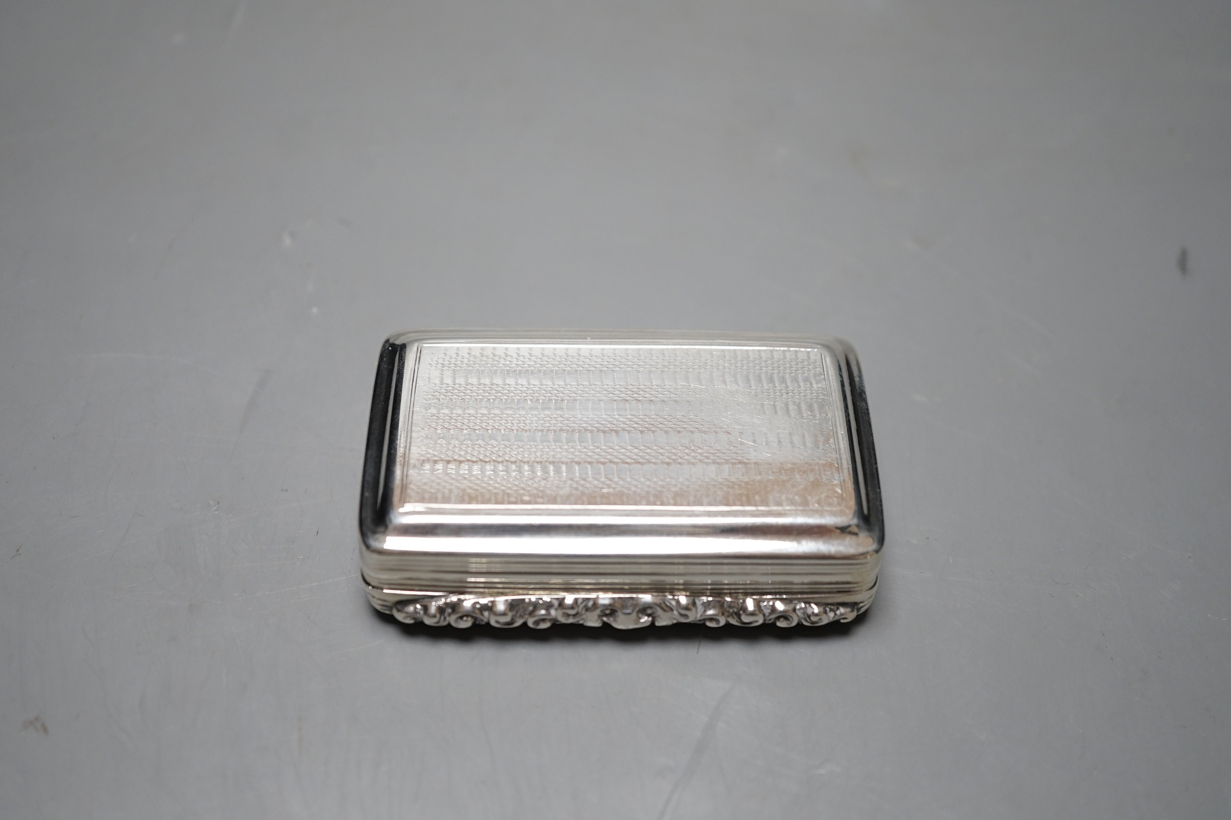 A William IV engraved silver rectangular snuff box, Edward Smith, Birmingham, 1832, 75mm.